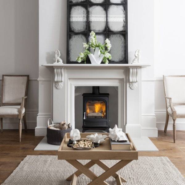 Arad Holborn in white fireplace